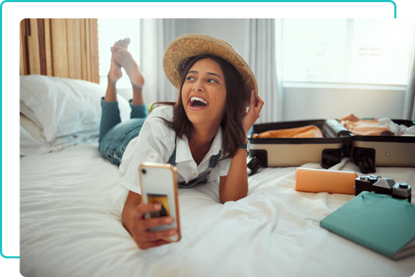 traveler taking a photo on the bed