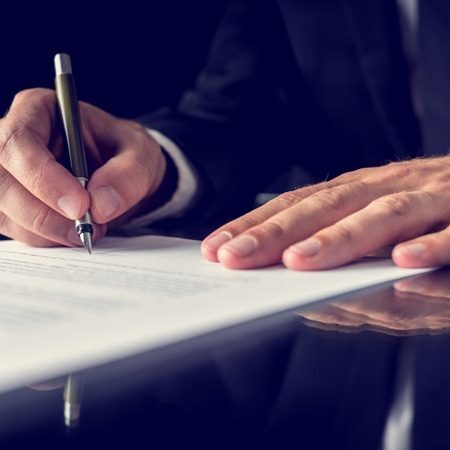 man writing a document